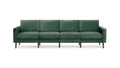 modern green velvet sofa with wooden legs and clean lines on the back, featuring a clean, modern design