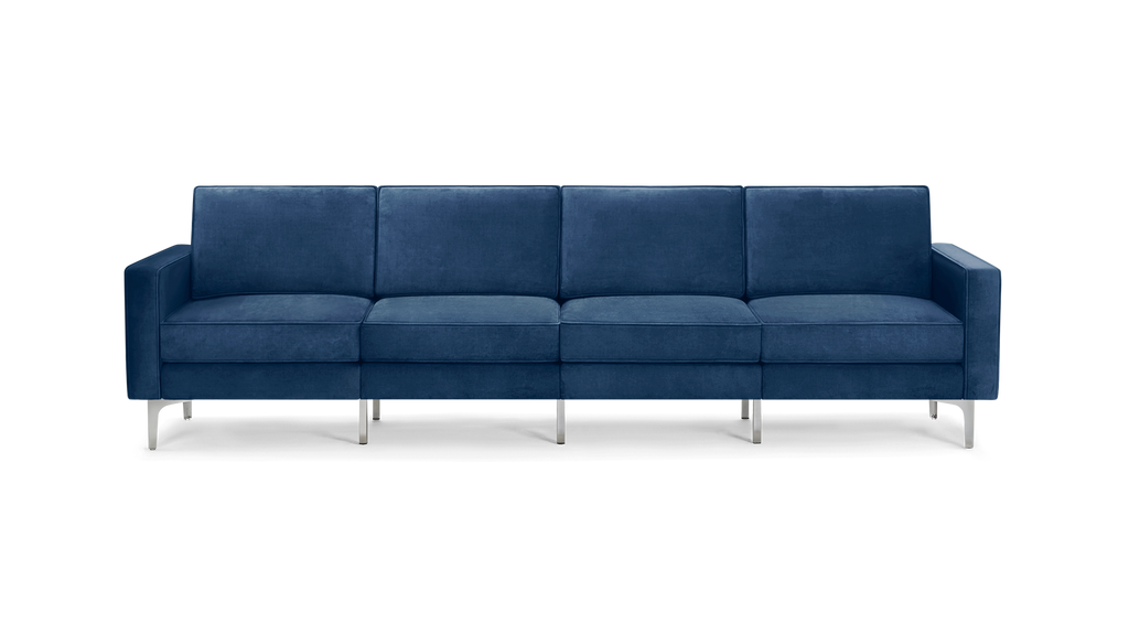 modern navy blue velvet sofa with chrome legs and clean lines on the back, featuring a clean, modern design