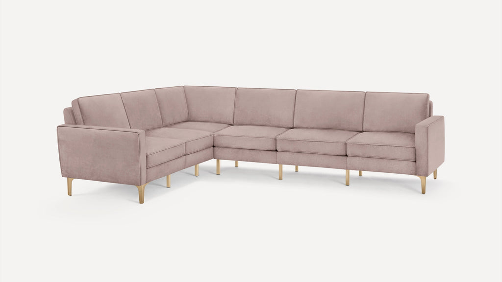 L-shaped modern sectional sofa with plush dusty pink upholstery and gold metal legs, designed for spacious seating.