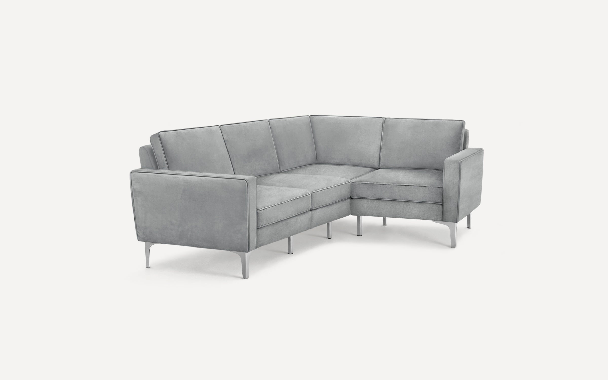 Modern light gray velvet L-shaped sectional sofa with sleek metal legs and clean, straight-lined cushions.