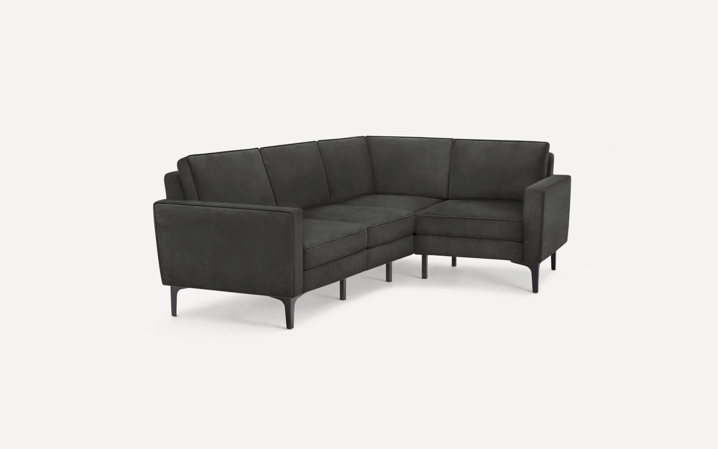 Modern dark gray L-shaped sectional sofa with sleek armrests and angled black legs, designed for a contemporary living space.