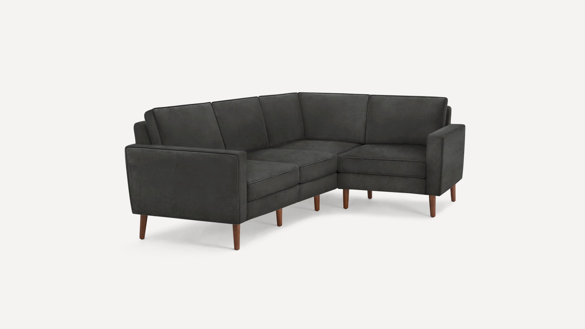 Dark gray modern sectional sofa with clean lines, tufted cushions, and wooden tapered legs on a white background.