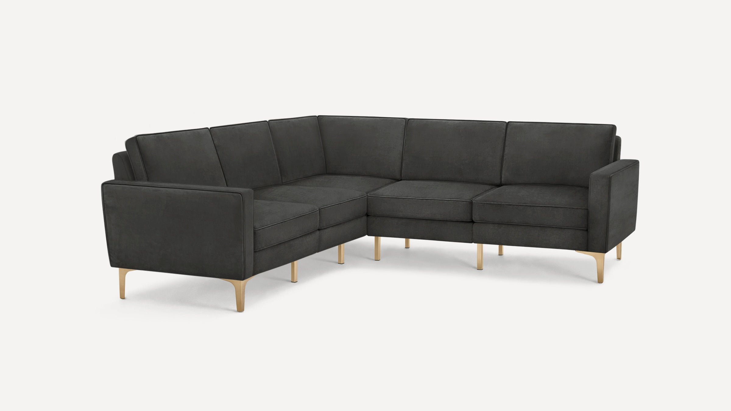 Modern L-shaped sectional sofa in dark gray fabric with slim gold metal legs and clean, minimalist design.