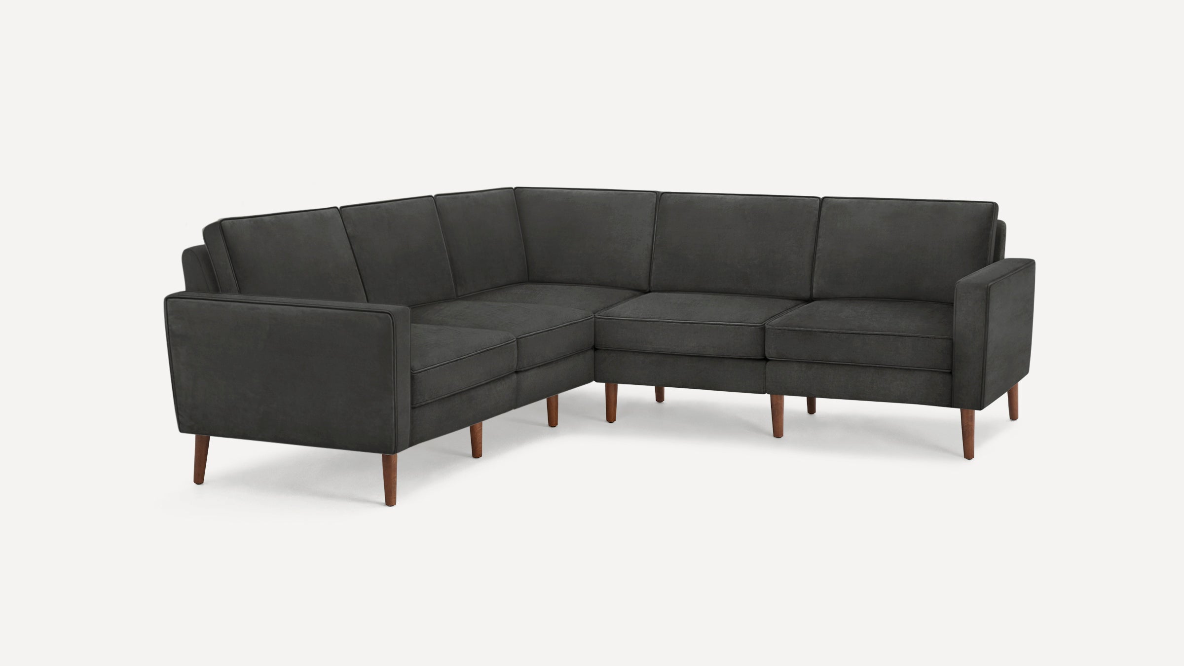 Dark gray modern L-shaped sectional sofa with clean lines, cushioned seats, and wooden tapered legs on a white background.