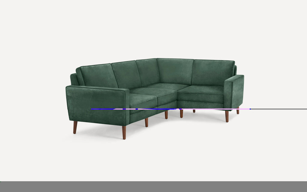 Green velvet L-shaped sectional sofa with wooden tapered legs and clean, modern lines on a white background.