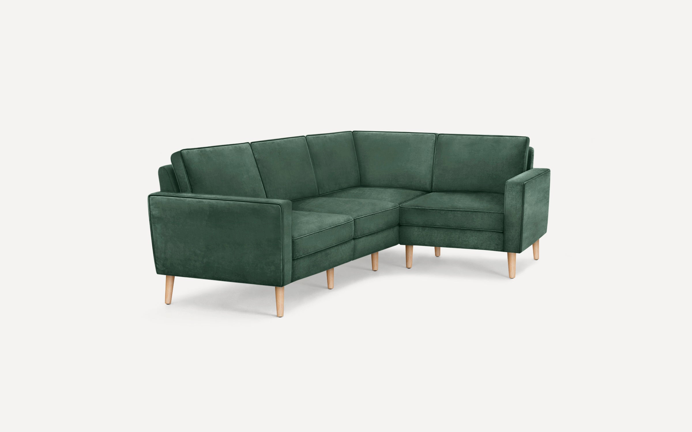 Modern green velvet L-shaped sectional sofa with wooden legs, featuring clean lines and cushioning on seat and backrest.