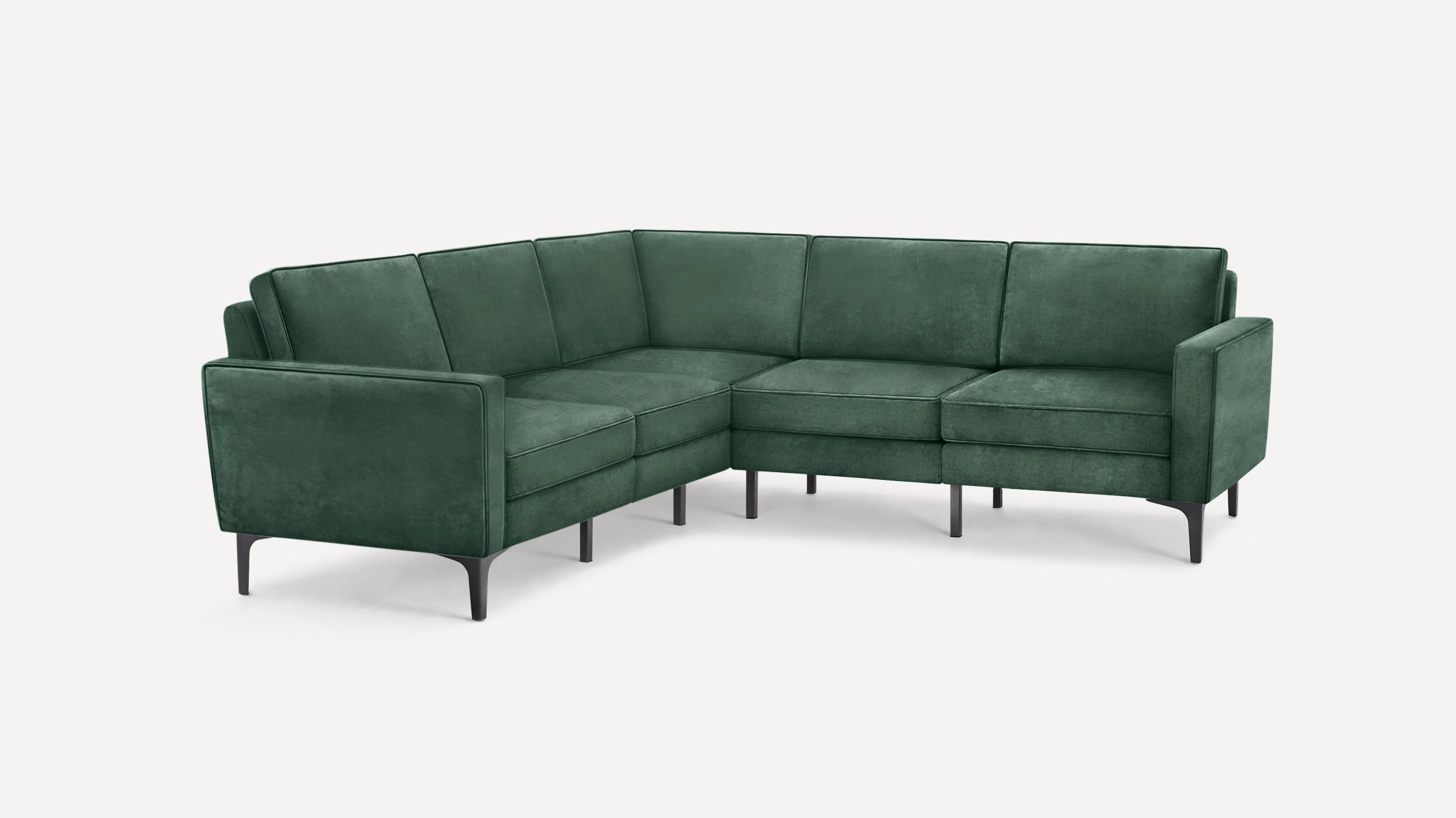 Green velvet sectional sofa with sleek black legs, featuring clean lines and modern design, shown against a white background.