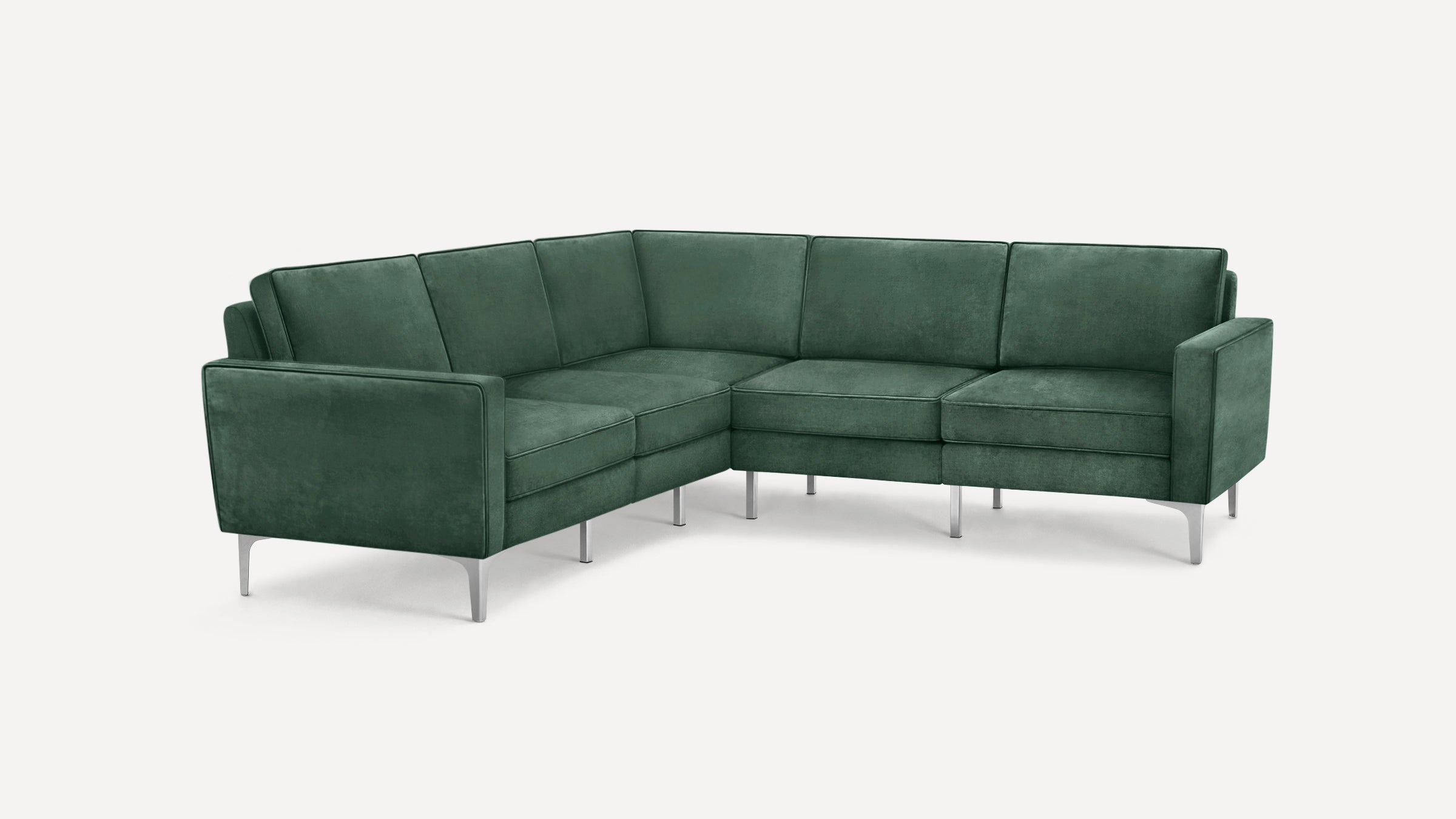 Modern green velvet L-shaped sectional sofa with slim silver metal legs and clean lines, designed for corner seating.