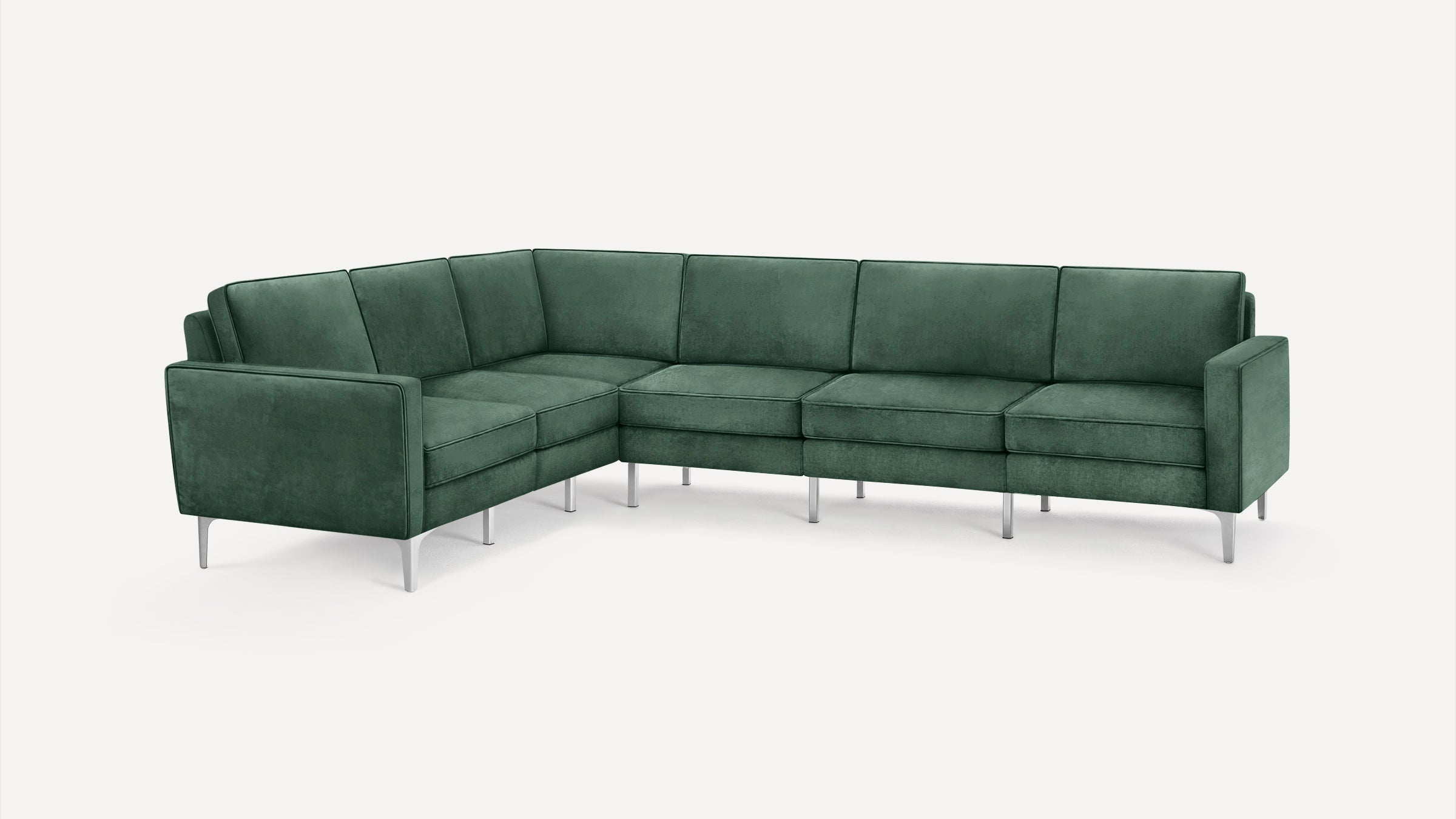 L-shaped sectional sofa in dark green upholstery with sleek metal legs and clean, modern design on a plain white background.