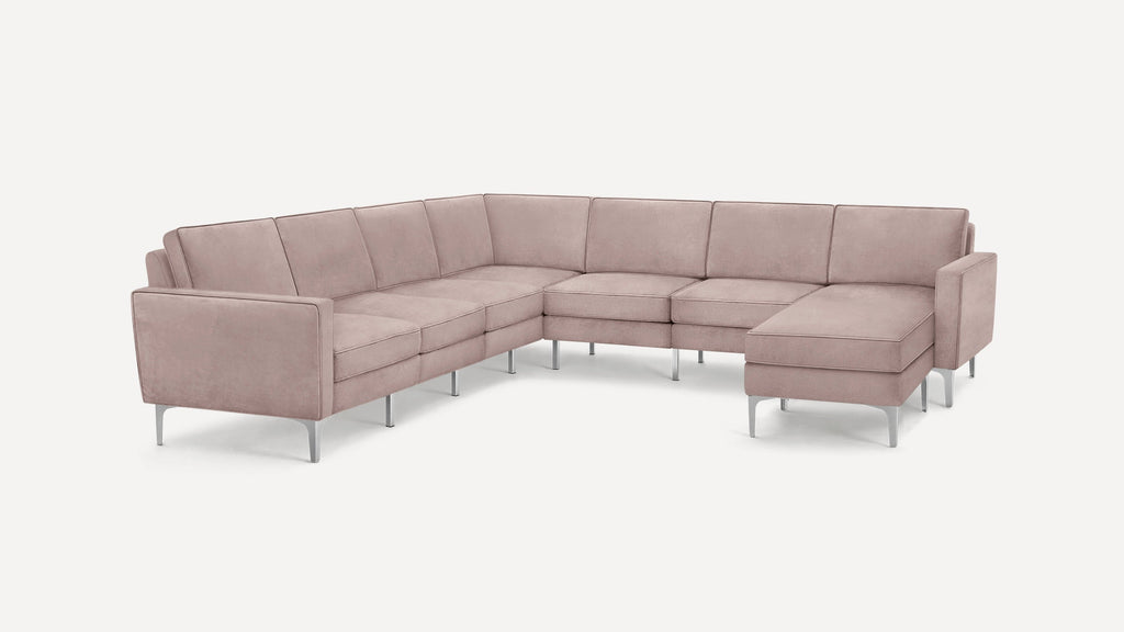 Light pink velvet L-shaped sectional sofa with metal legs and clean, modern design on a white background.