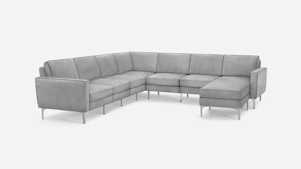 Modern gray velvet L-shaped sectional sofa with metal legs and clean, straight lines on a white background.