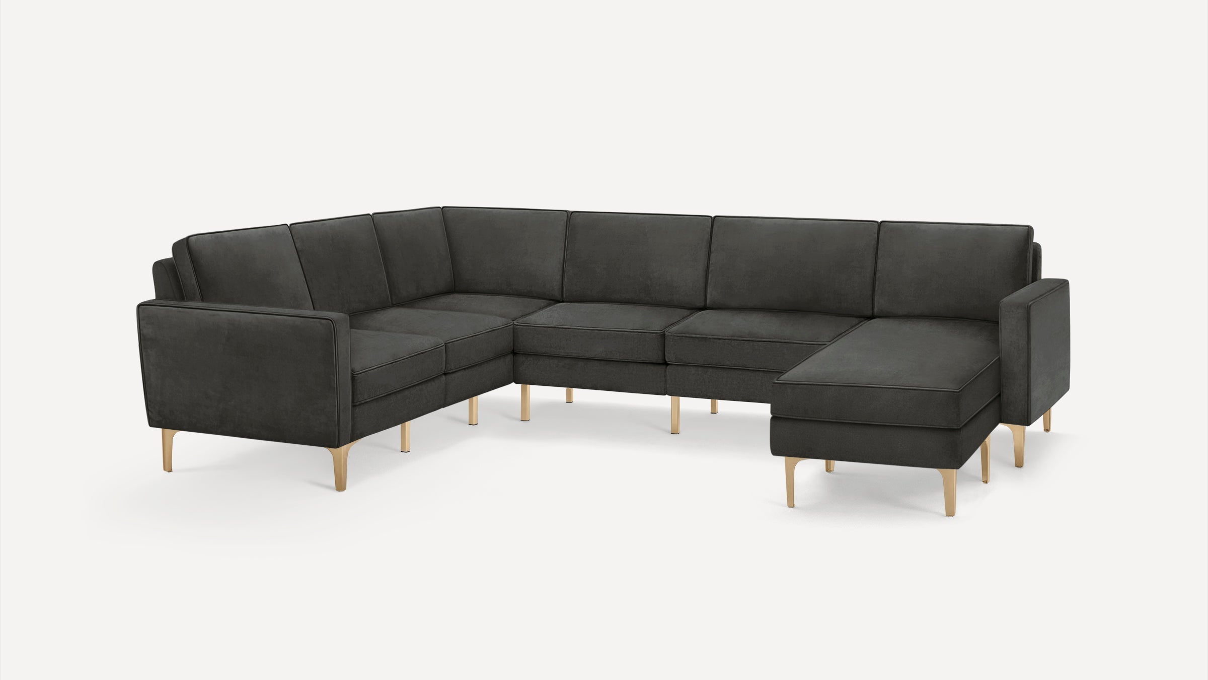 Dark gray L-shaped sectional sofa with thin light wooden legs and clean, modern design on a white background.