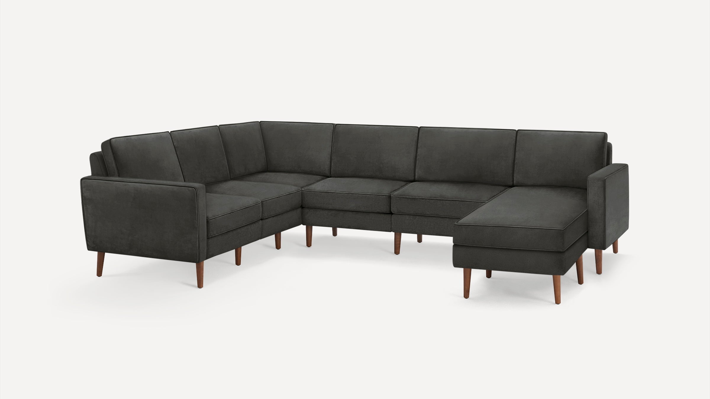 Dark gray L-shaped sectional sofa with wooden legs, featuring a modern minimalist design and cushioned seats and backrests.