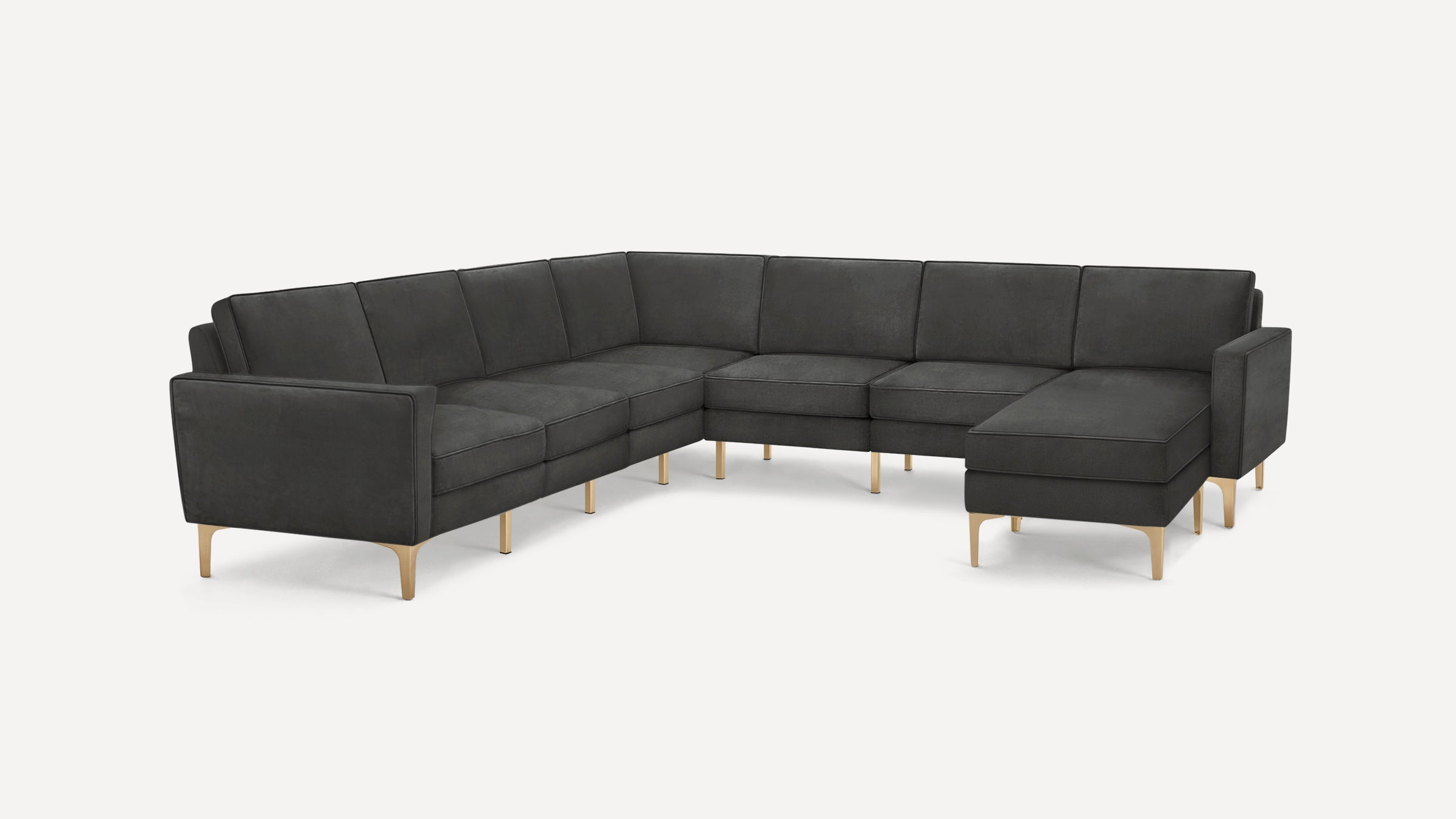 Dark gray L-shaped sectional sofa with cushioned seats, backrests, and light wooden legs, on a plain white background.