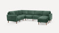 Green velvet L-shaped sectional sofa with wooden legs and modern, clean-lined design against a white background.