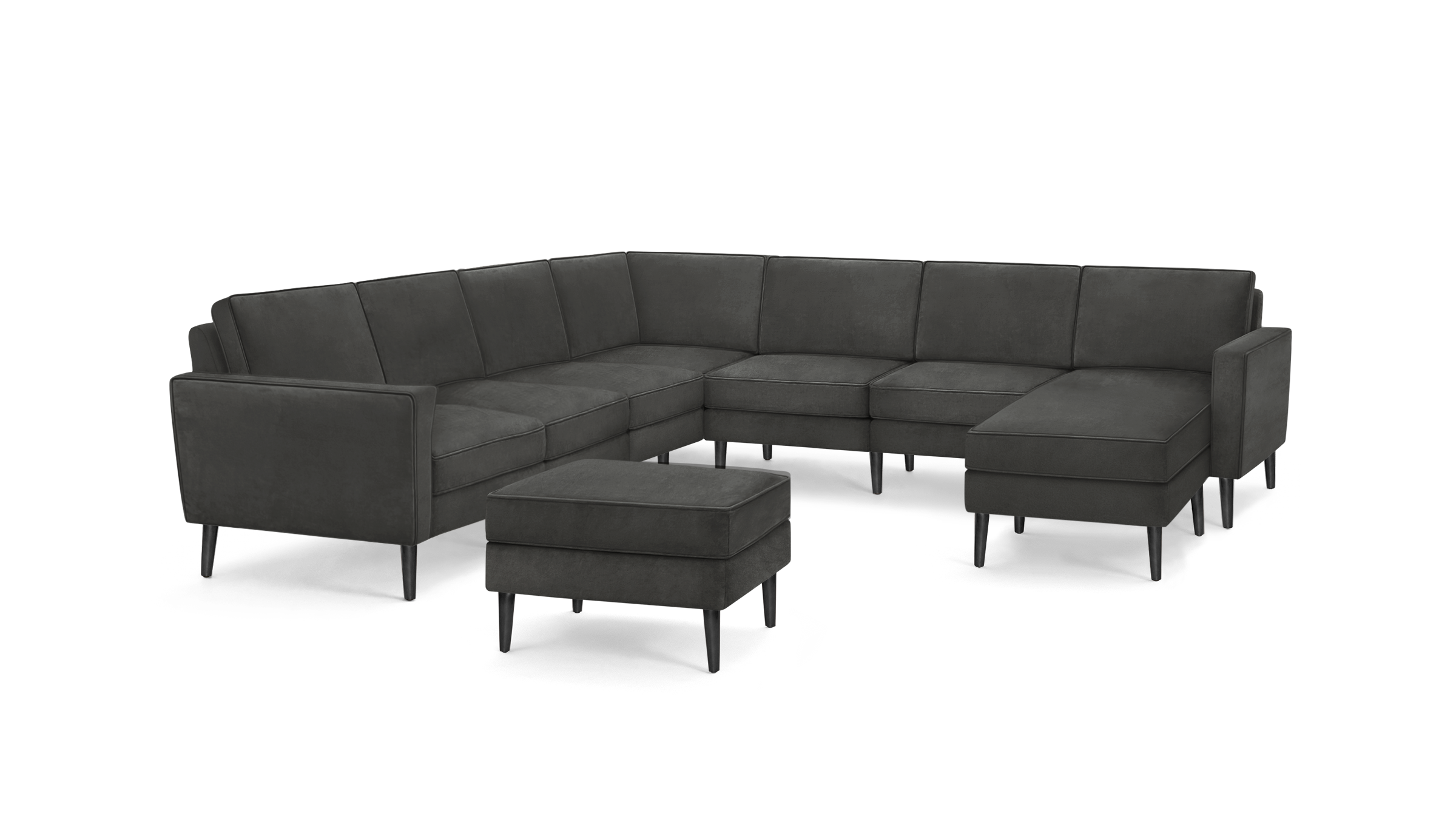 modern dark gray sectional sofa with tufted back cushions and matching ottoman, featuring a matching ottoman, and matching ottoman