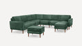 Dark green velvet L-shaped sectional sofa with wooden legs and matching ottoman on white background.