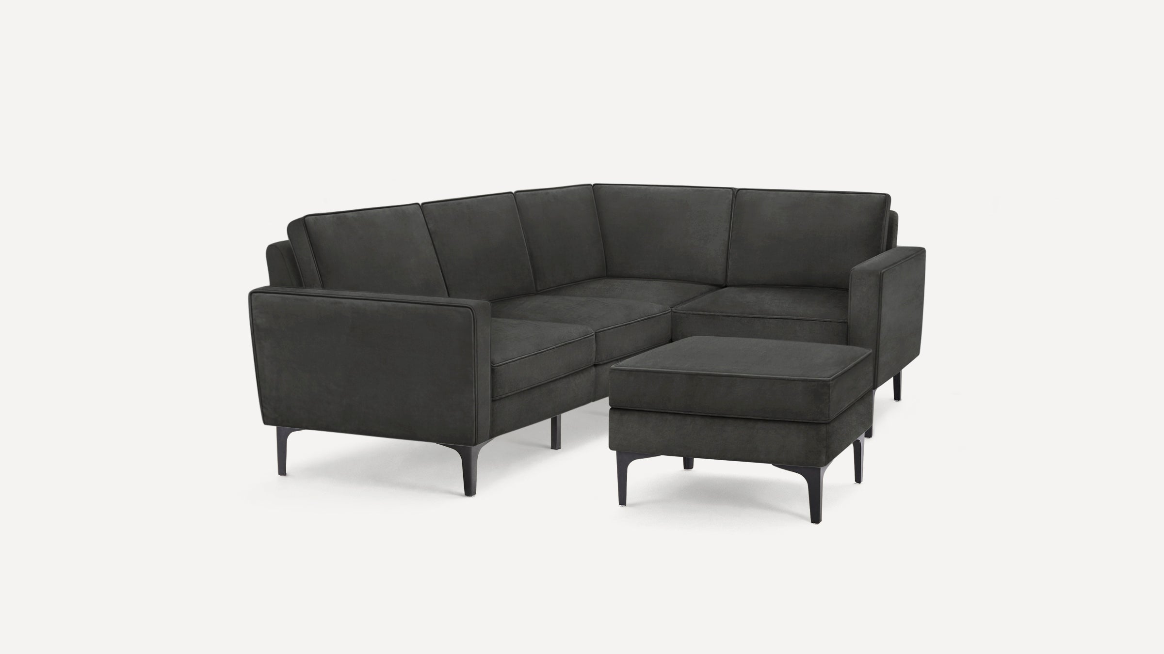 Dark gray modern sectional sofa with clean lines, metal legs, and a matching ottoman on a plain white background.