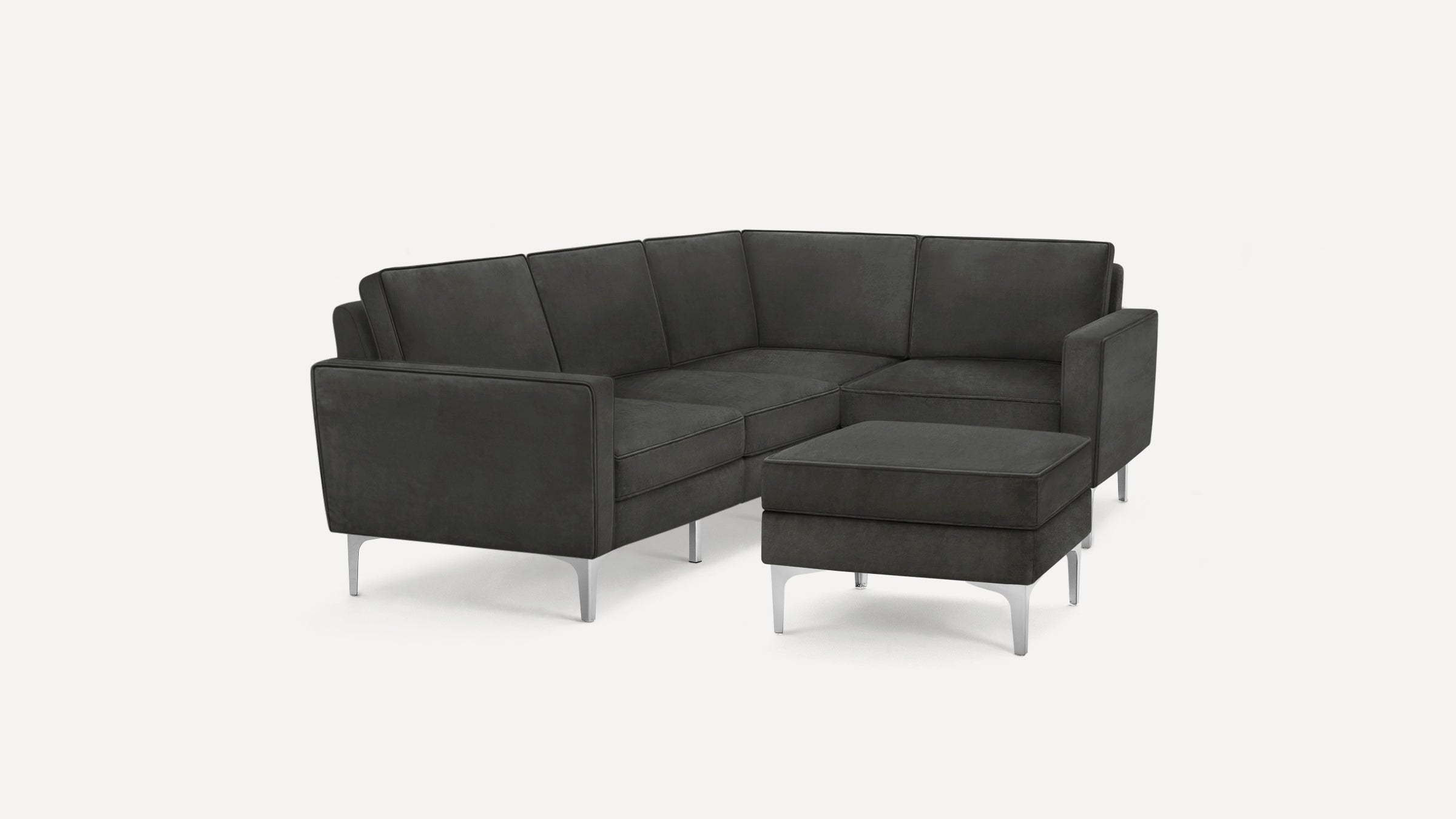 Modern dark gray sectional sofa with metal legs and matching ottoman, featuring clean lines and minimalist design.