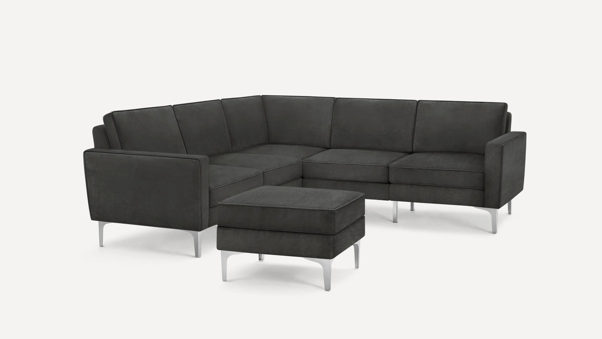 Modern dark grey sectional sofa with clean lines, chrome legs, and a matching ottoman against a plain white background.