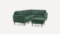 Green velvet L-shaped sectional sofa with wooden legs, accompanied by a matching ottoman.