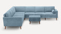 modern light blue sectional sofa with wooden legs and matching ottoman on white background