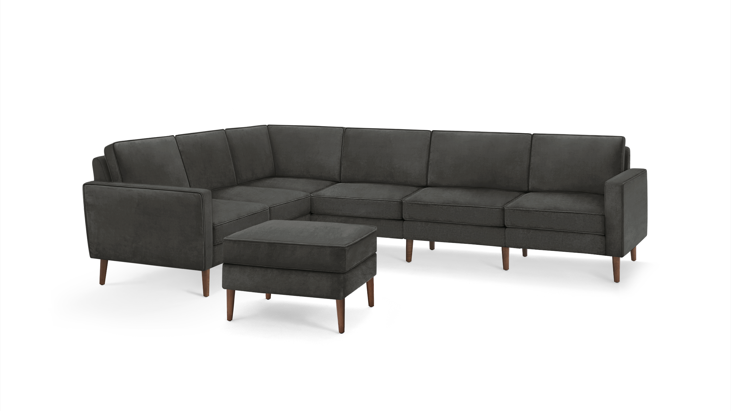 modern dark gray sectional sofa with matching ottoman and matching ottoman, featuring wooden legs and clean lines on the back wall