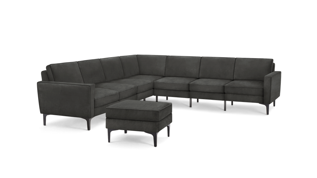 modern dark gray sectional sofa with tufted back cushions and matching ottoman, featuring sleek lines and sleek lines