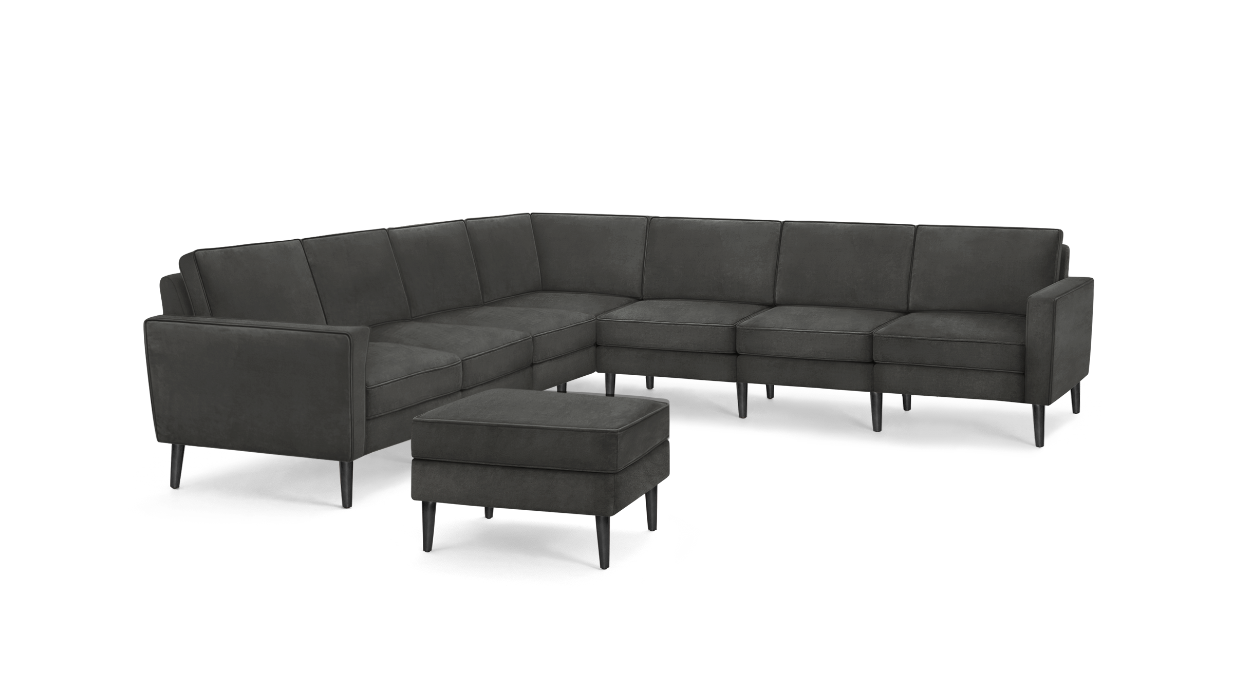 modern dark gray sectional sofa with tufted back cushions and matching ottoman, featuring black tapered legs and matching ottoman