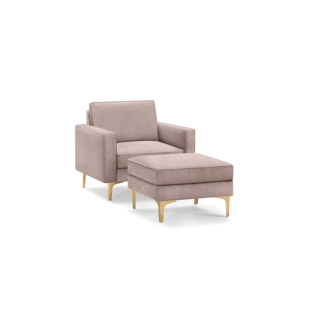 modern light pink upholstered armchair with matching ottoman, featuring tapered legs and a sleek, minimalist design