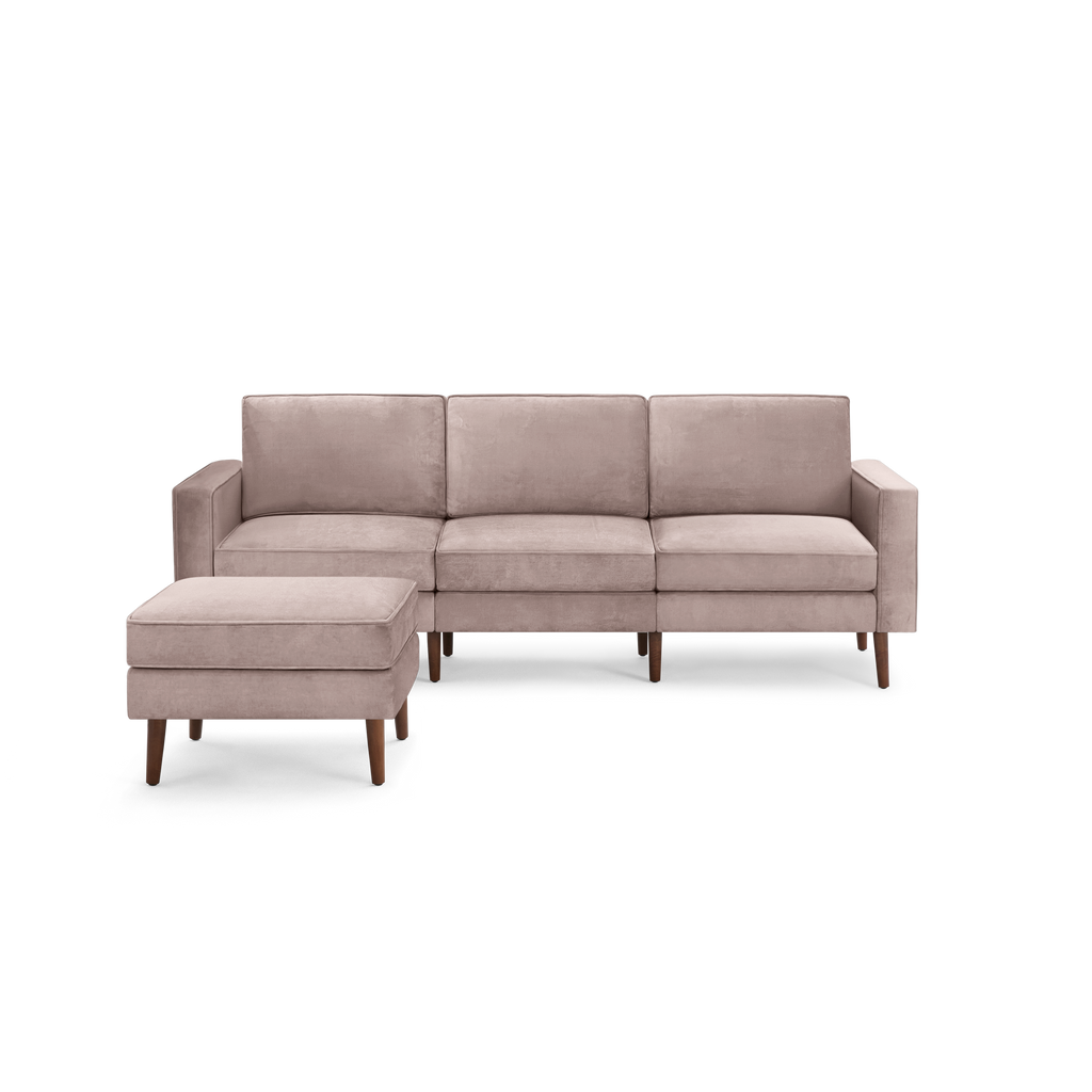 modern beige sectional sofa with wooden legs and a chaise lounge on the right side, featuring a clean, minimalist design