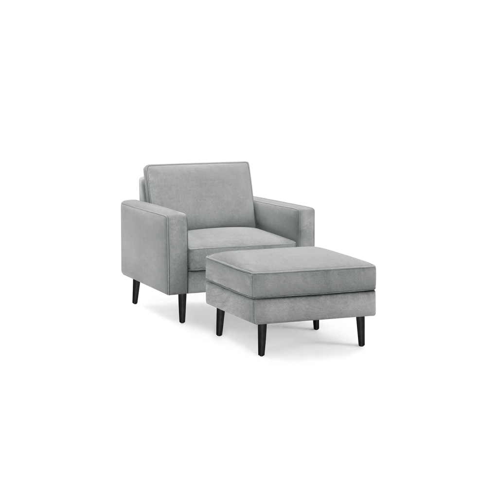 modern gray upholstered armchair with matching ottoman, featuring a sleek black metal frame, and tapered wooden legs