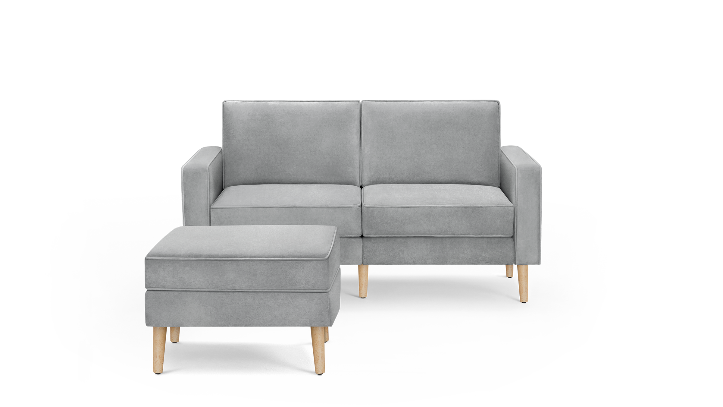 modern light gray velvet upholstered sofa with matching ottoman and wooden legs, featuring a sleek design and clean lines
