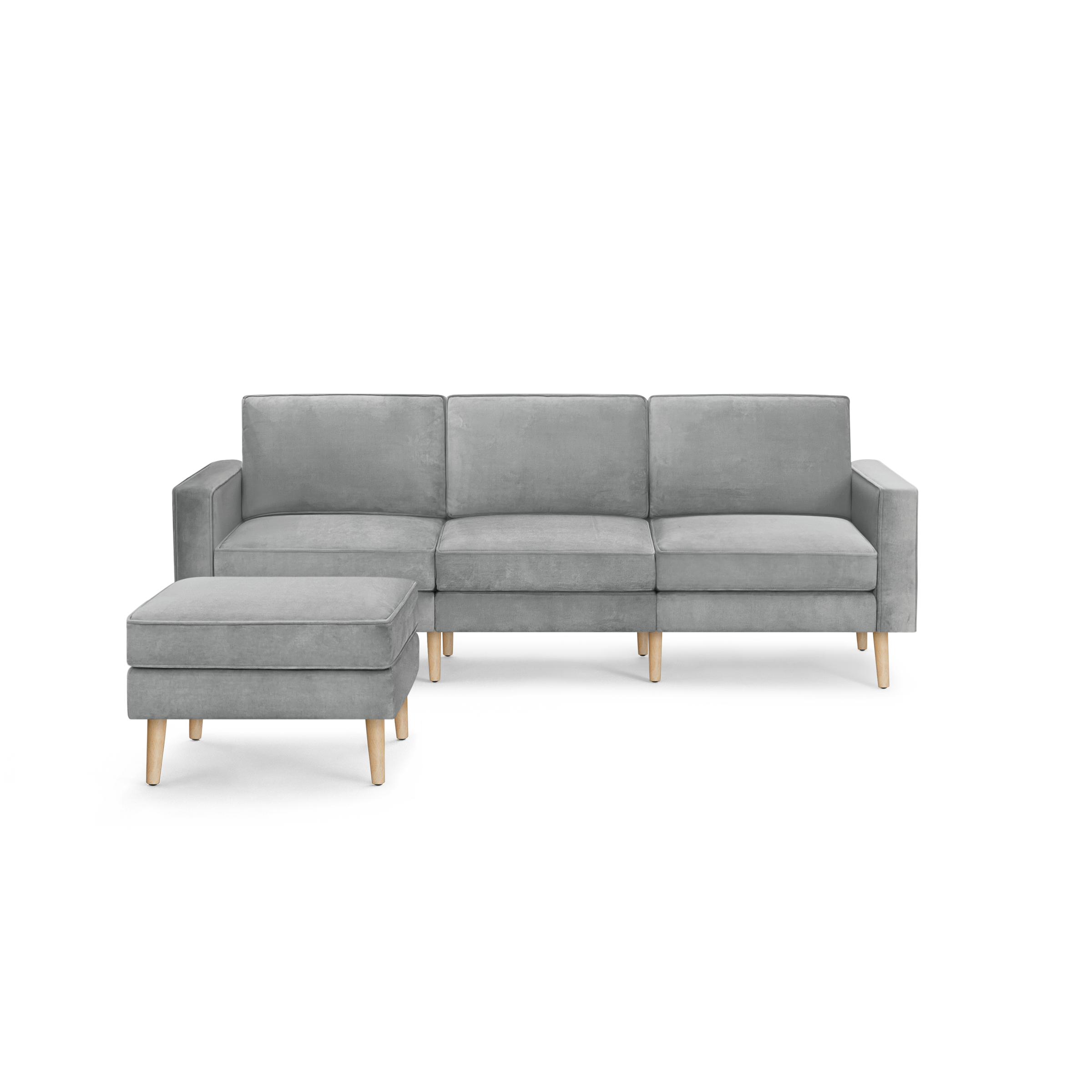 modern light gray fabric sectional sofa with wooden legs and clean lines on the back, featuring a chaise lounge and matching ottoman