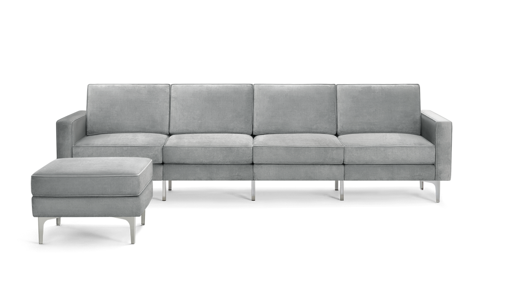 modern gray velvet sectional sofa with matching ottoman, featuring sleek metal legs and sleek design on the back, featuring a sleek design