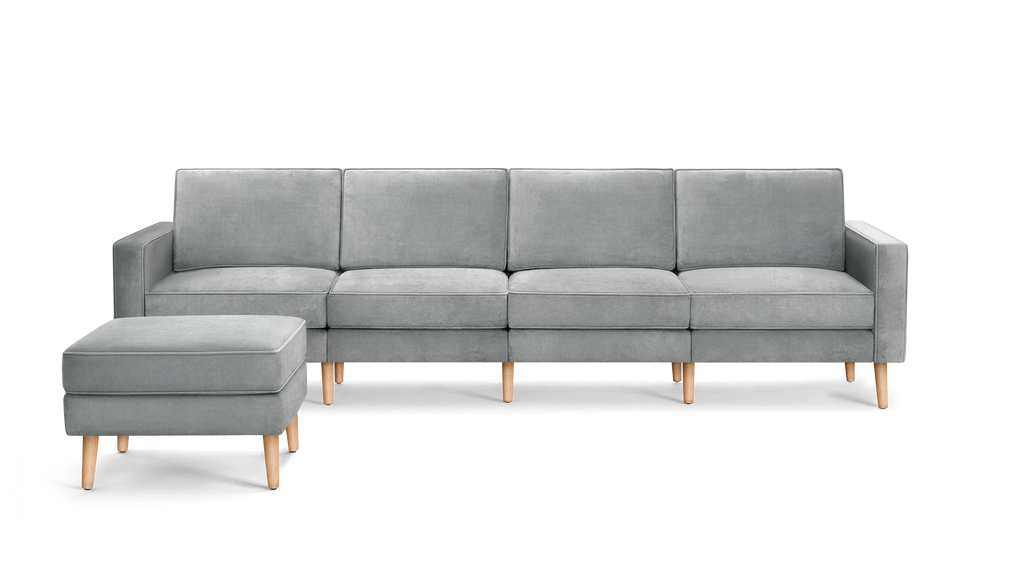 modern light gray velvet sectional sofa with wooden legs and matching ottoman, featuring clean lines and clean lines on the back