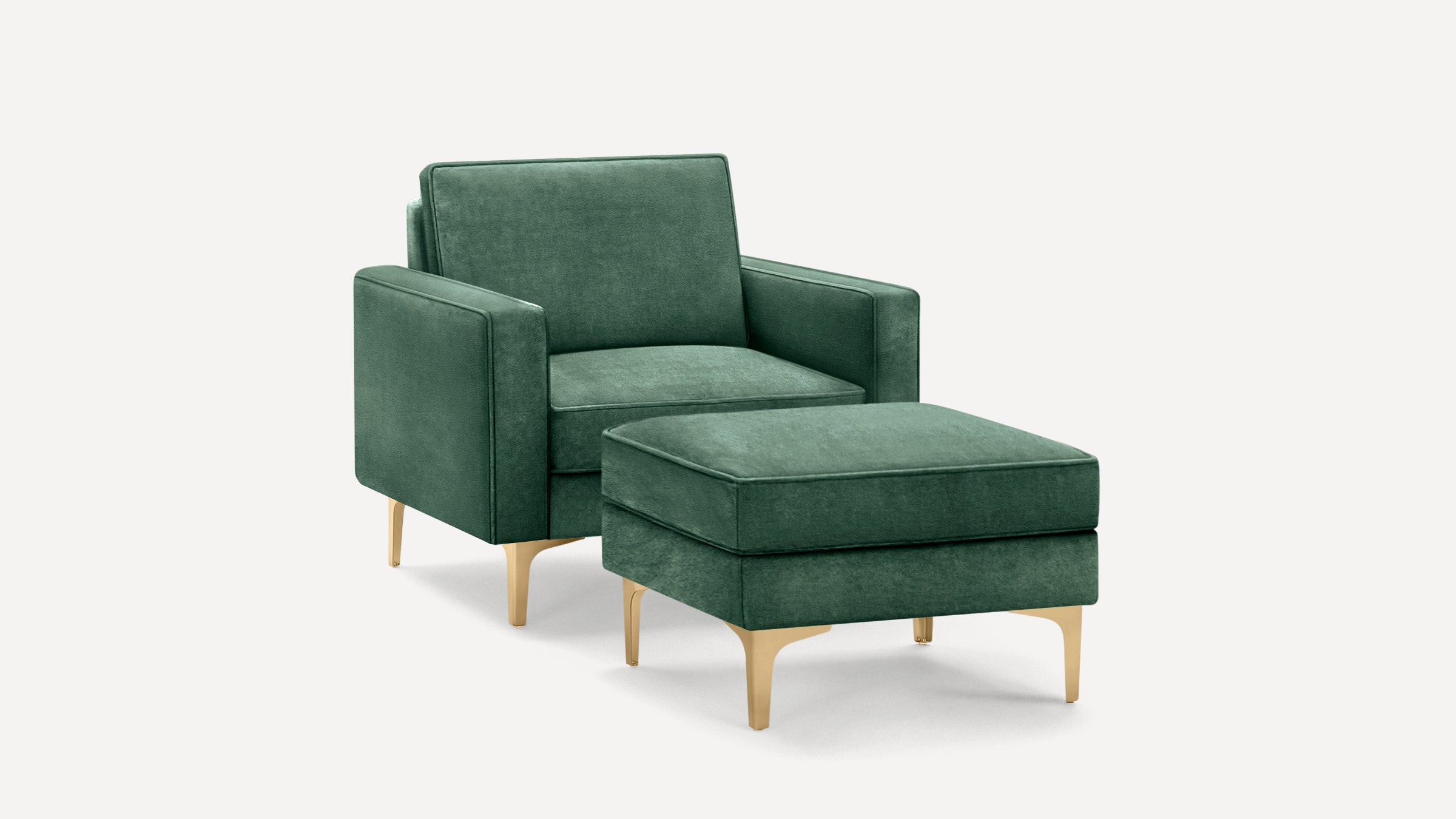 Modern green velvet armchair with matching ottoman, featuring gold metal legs and clean, angular design.