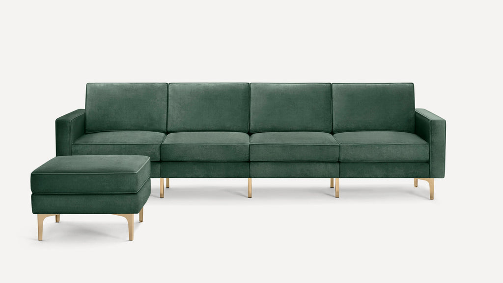 Dark green velvet sectional sofa with chaise lounge and gold metal legs, modern and minimalist design.