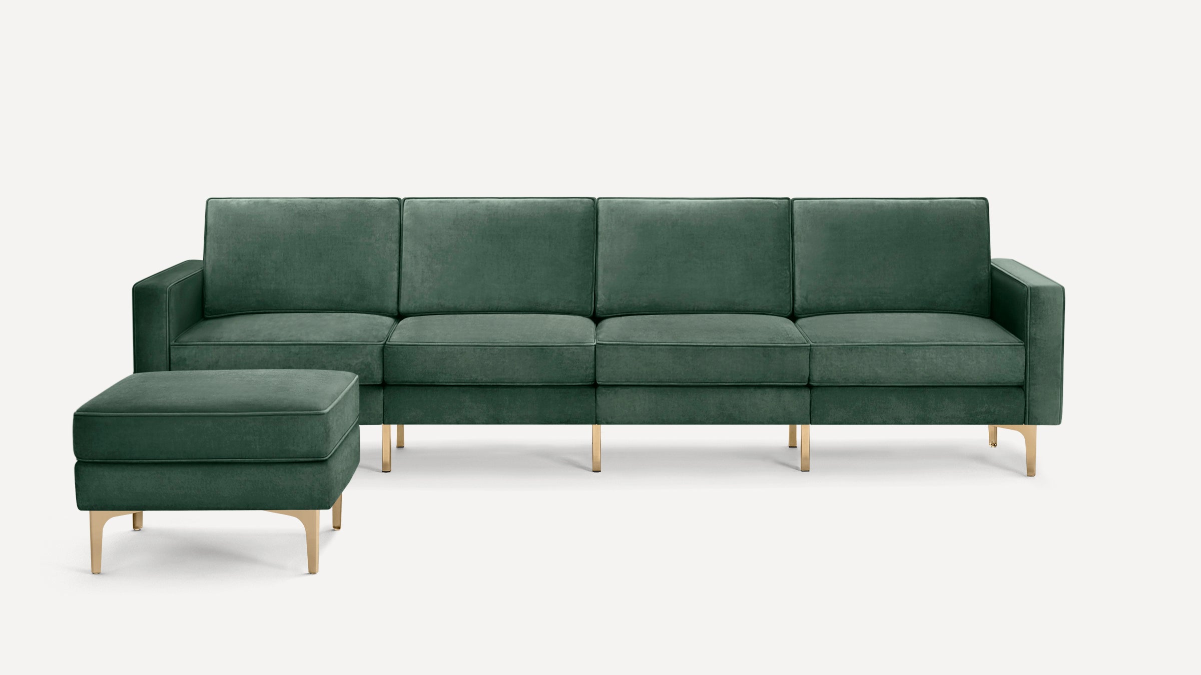 Dark green velvet sectional sofa with chaise lounge and gold metal legs, modern and minimalist design.