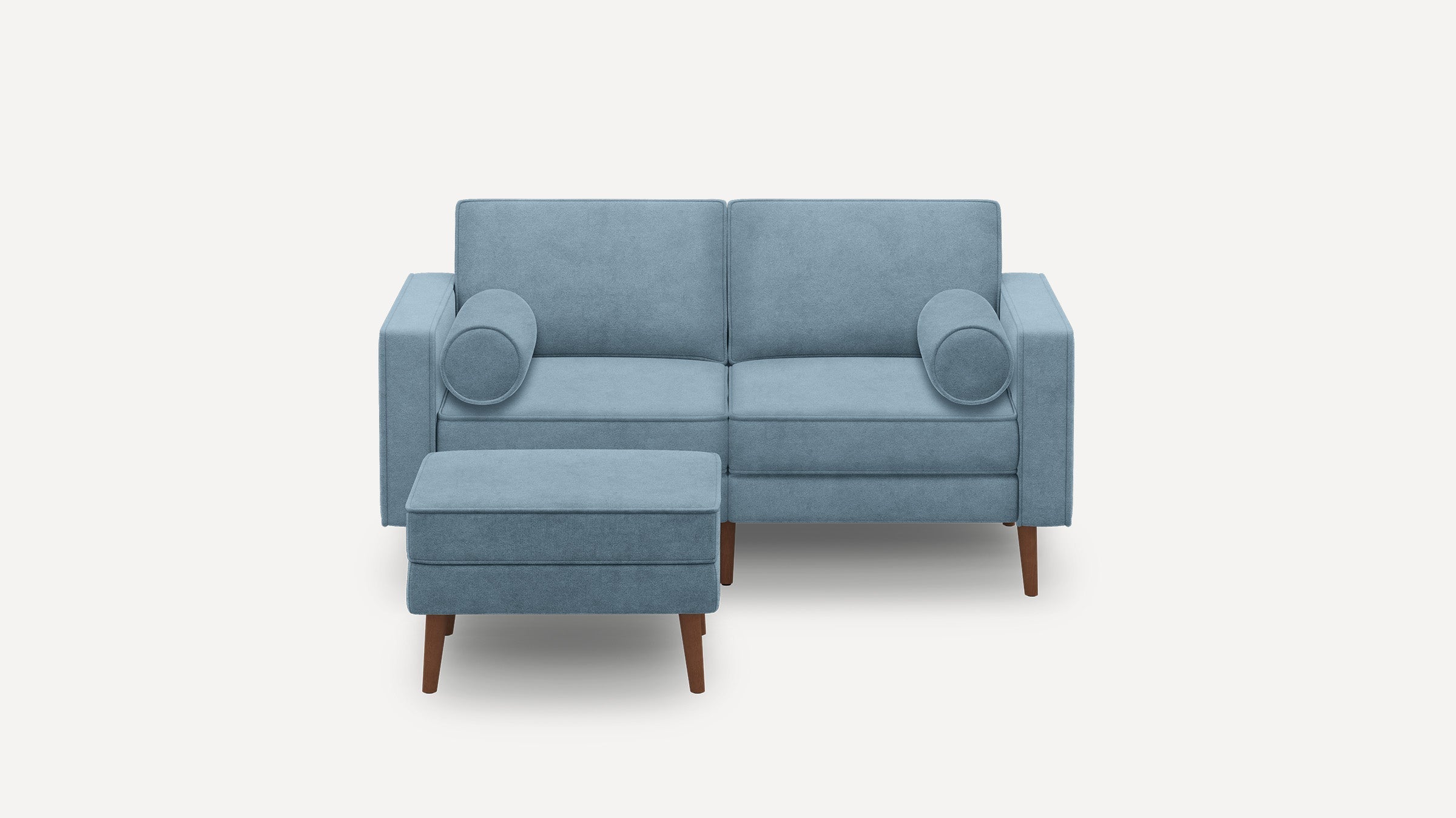 modern light blue fabric sofa with matching ottoman and wooden legs, featuring a rounded backrest and a rounded cushion on the right side
