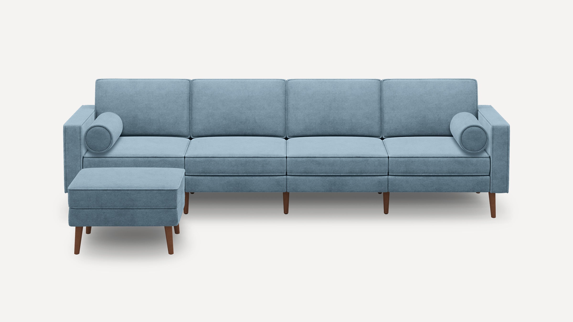 modern light blue fabric sectional sofa with wooden legs and matching ottoman on white background