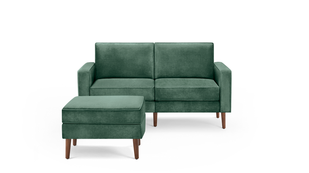 modern green velvet upholstered sofa with matching ottoman, featuring a sleek wooden tapered legs and a sleek, clean, modern design