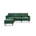 modern green velvet sectional sofa with wooden legs and matching ottoman, featuring a clean, minimal design