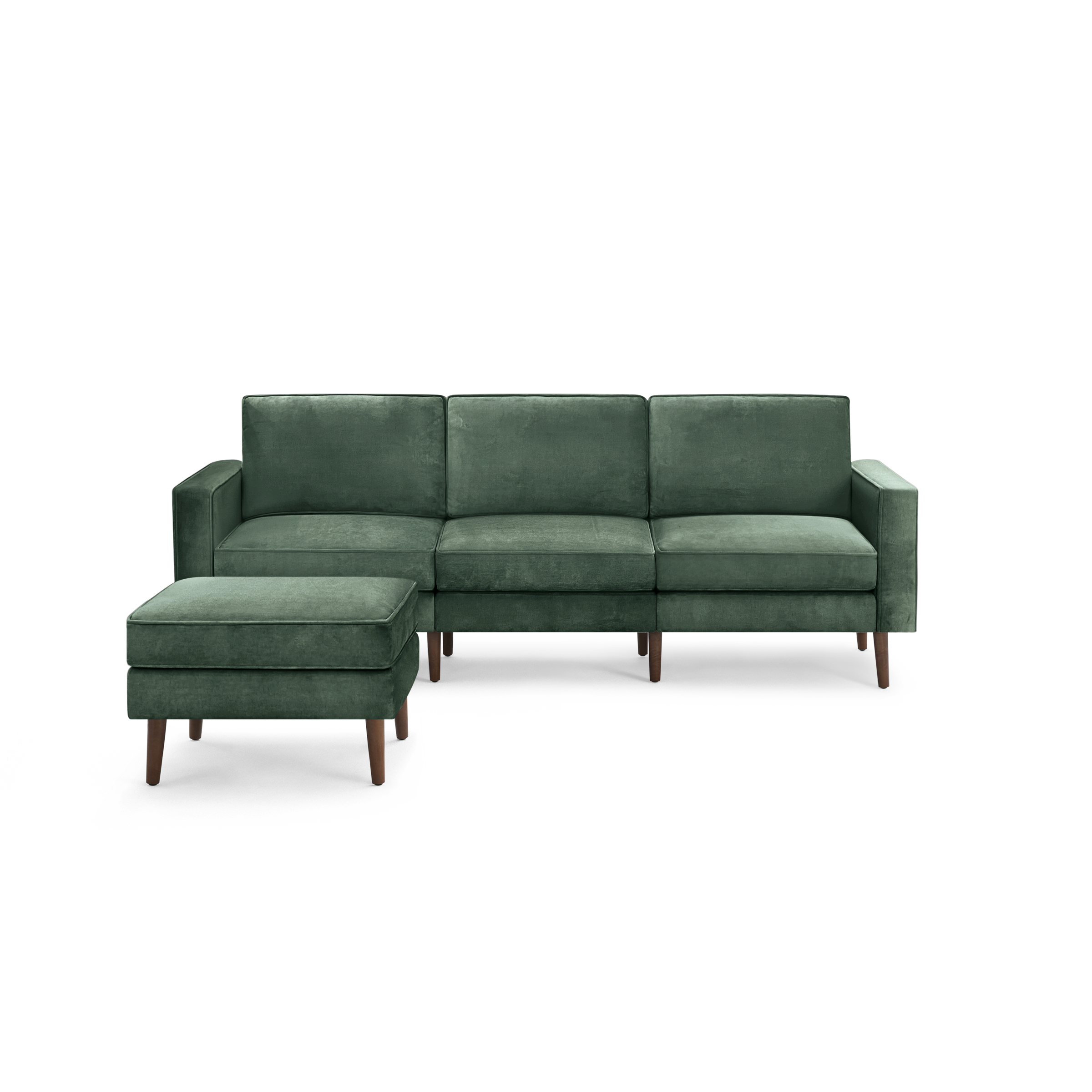 modern green velvet sectional sofa with wooden legs and matching ottoman, featuring a clean, minimal design