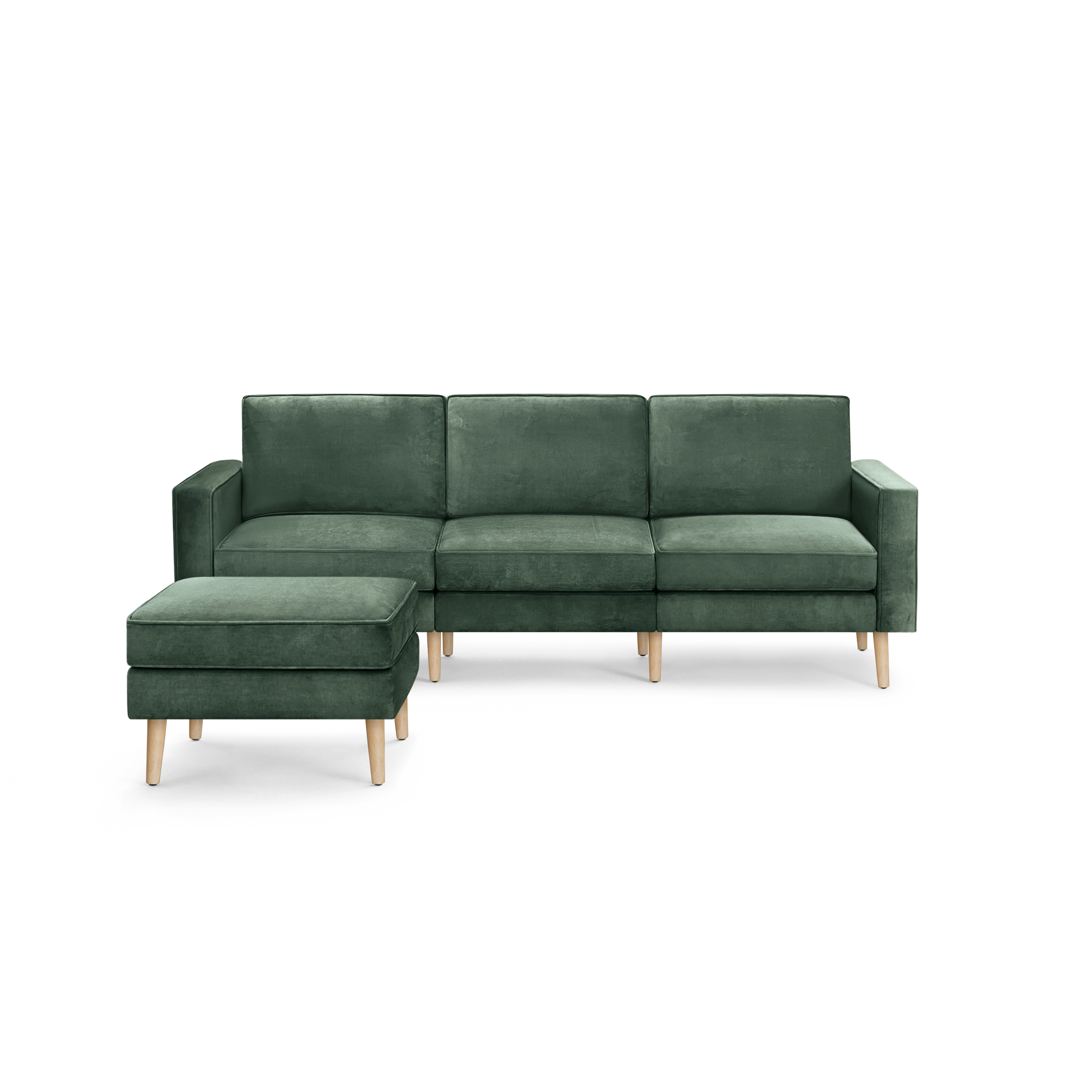 modern green velvet sectional sofa with wooden legs and clean lines on the back, featuring a chaise lounge and matching ottoman