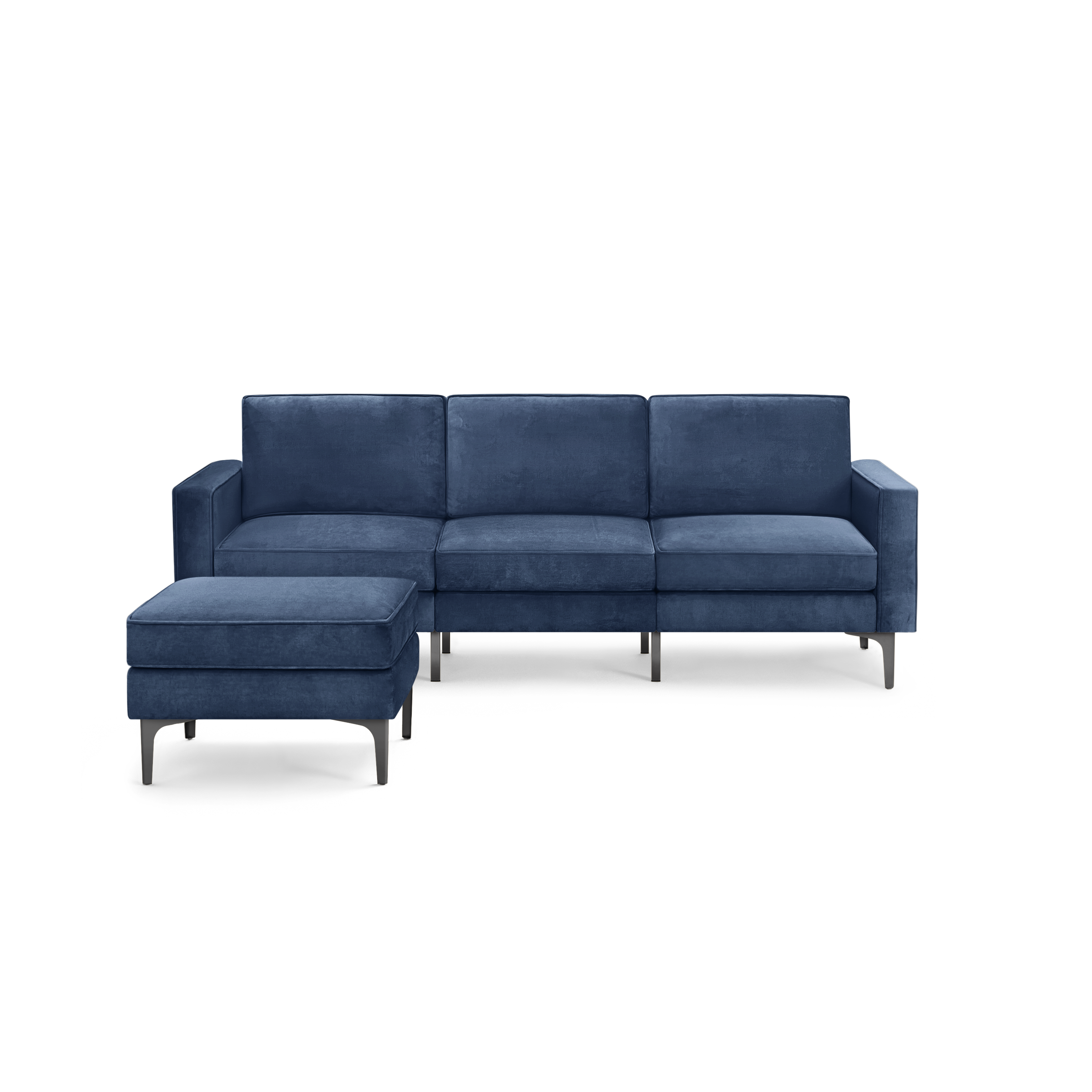 modern blue velvet sectional sofa with chaise lounge and matching ottoman, featuring sleek black metal legs, on a white background