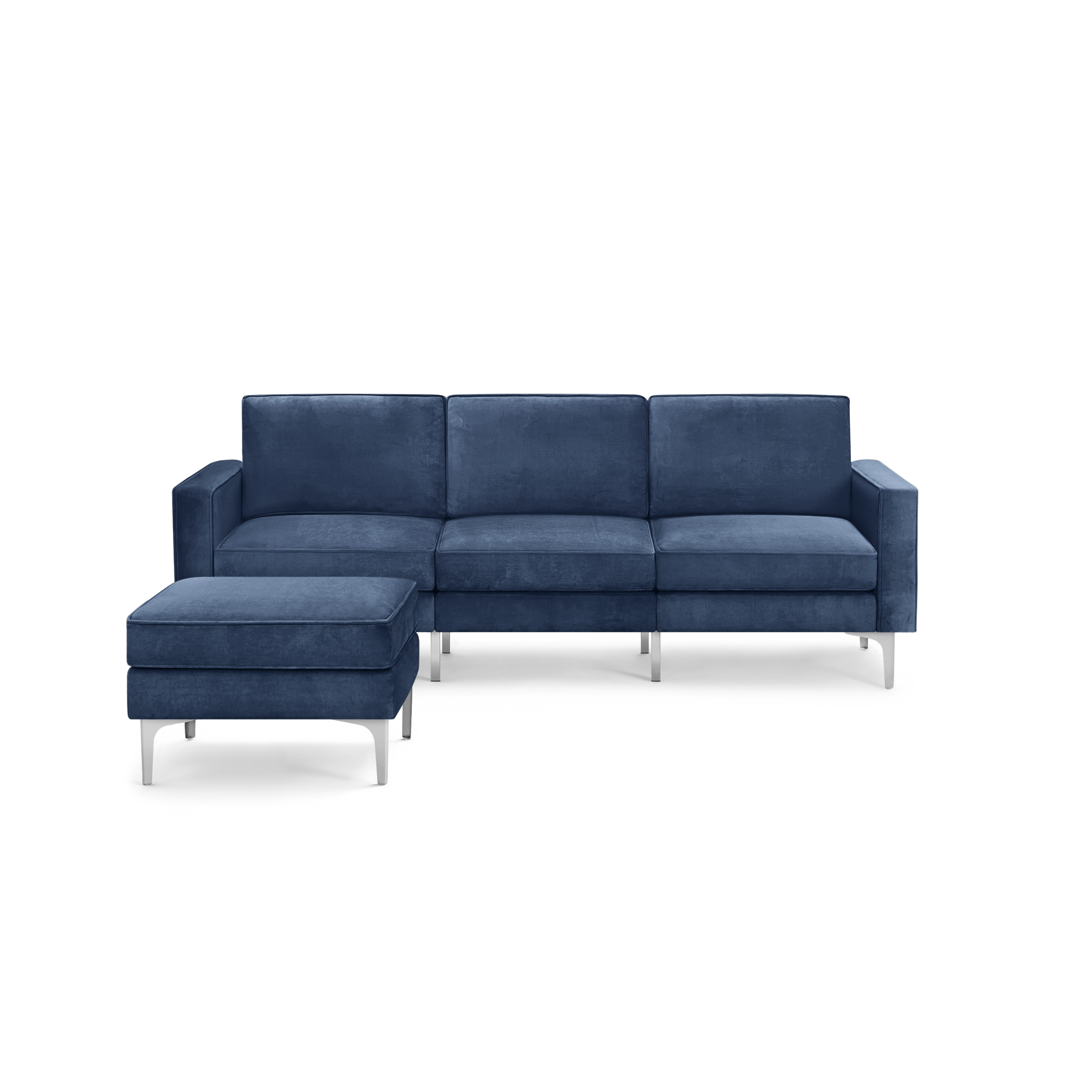 modern blue velvet sectional sofa with chrome legs and clean lines on the back, featuring a deep blue upholstery sofa and matching ottoman
