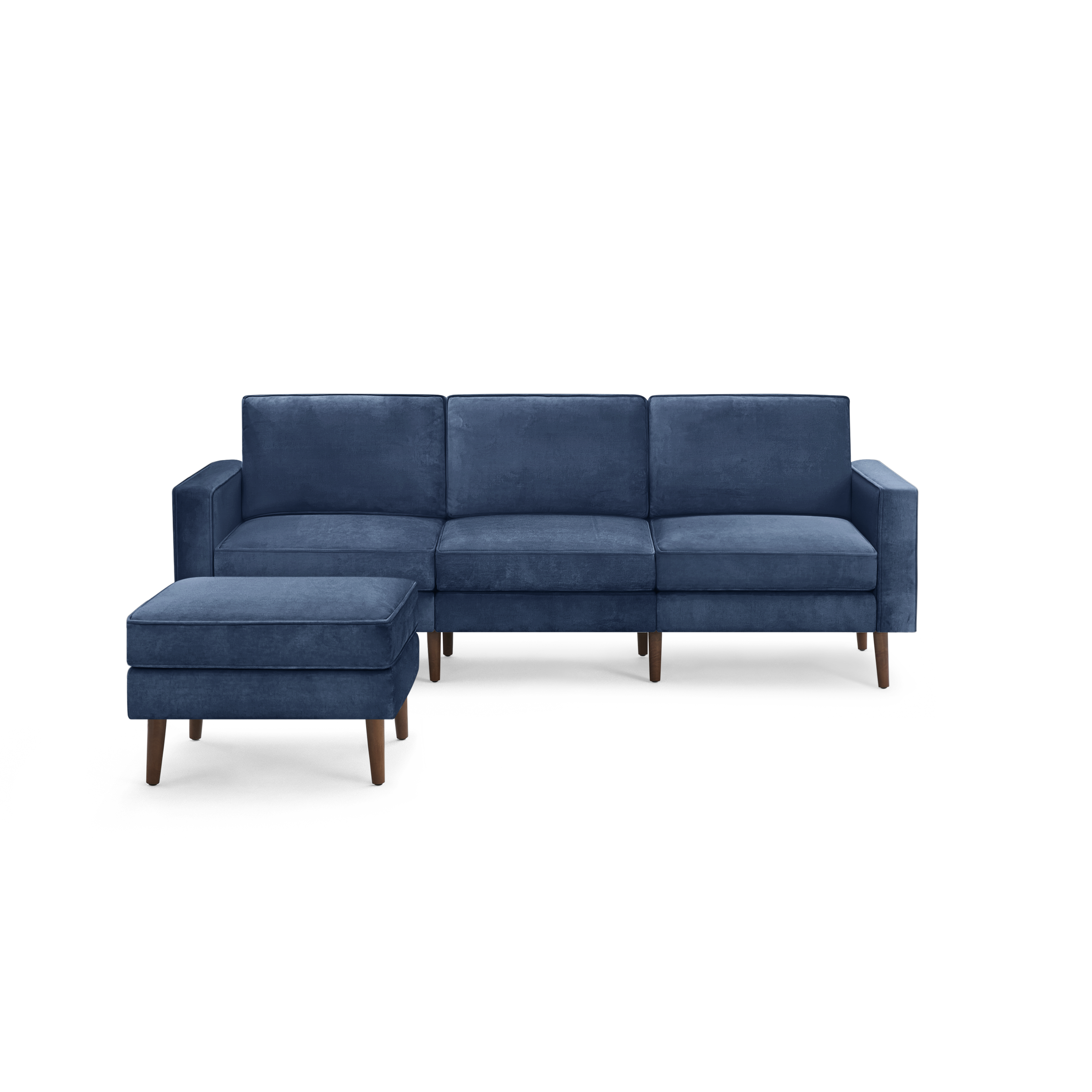 modern blue velvet sectional sofa with wooden legs and matching ottoman, featuring a deep blue upholstery design, featuring a clean, modern design