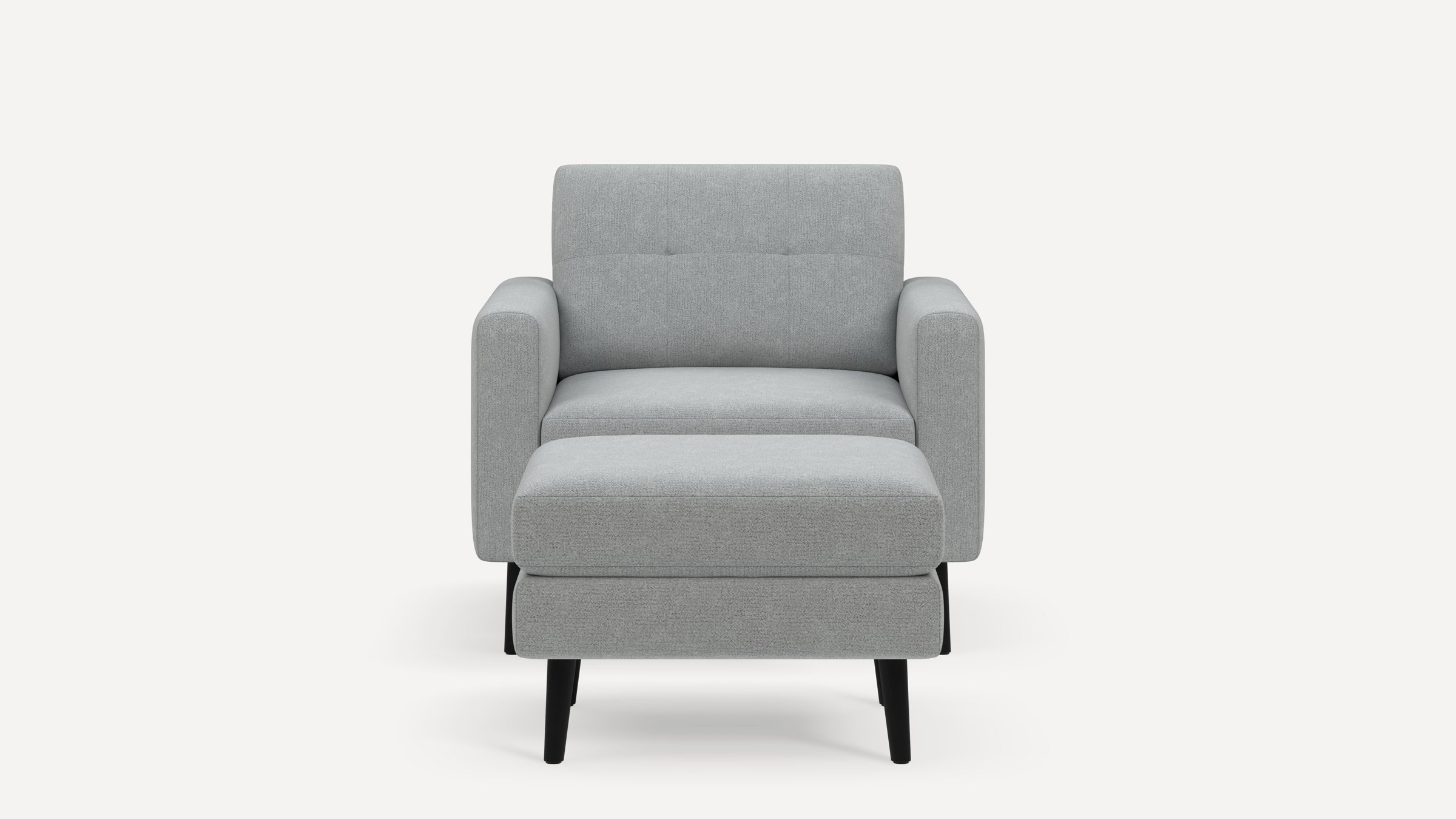 Modern light gray fabric armchair with straight arms, tufted backrest, cushioned seat, and black tapered legs, front view.
