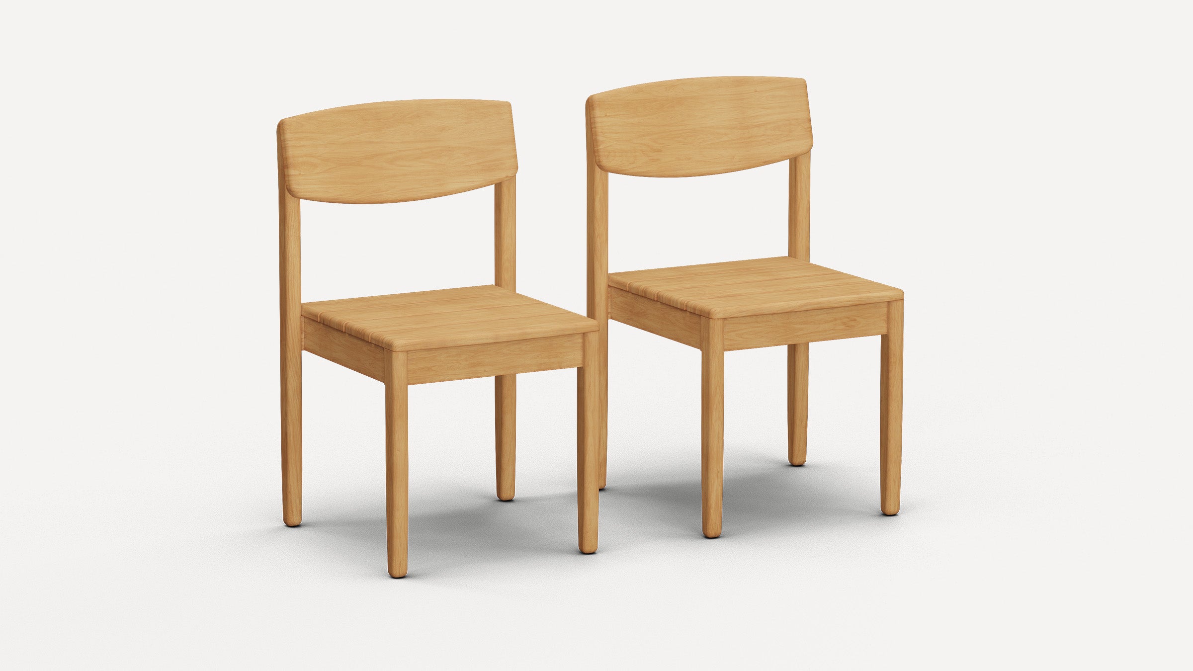 Two simple, light wood dining chairs with curved backrests and square seats on a white background.